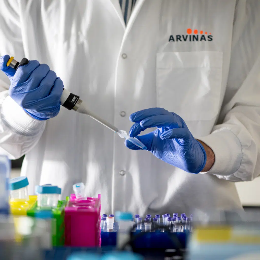 Arvinas scientific staff member preparing vials for testing