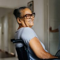 Happy elderly woman in wheelchair