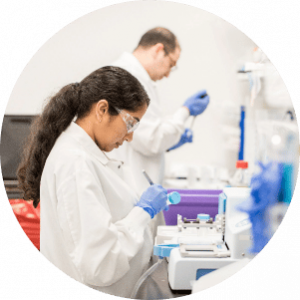 Arvinas scientific staff members preparing vials for testing